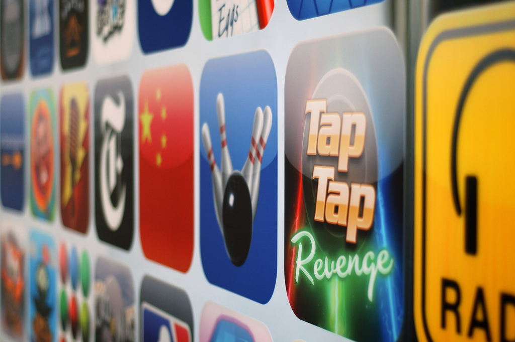 A grid of app icons from the early days of the App Store, prominantly featuring games like Tap Tap Revenge.